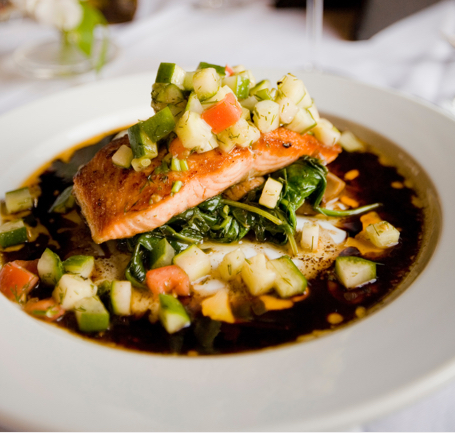 salmon dish on bed of vegtables